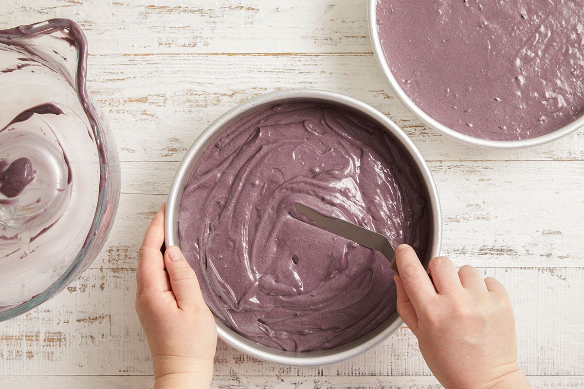 A horizontal image shows a purple-tinted batter being stirred, incorporating blackberry and food coloring.