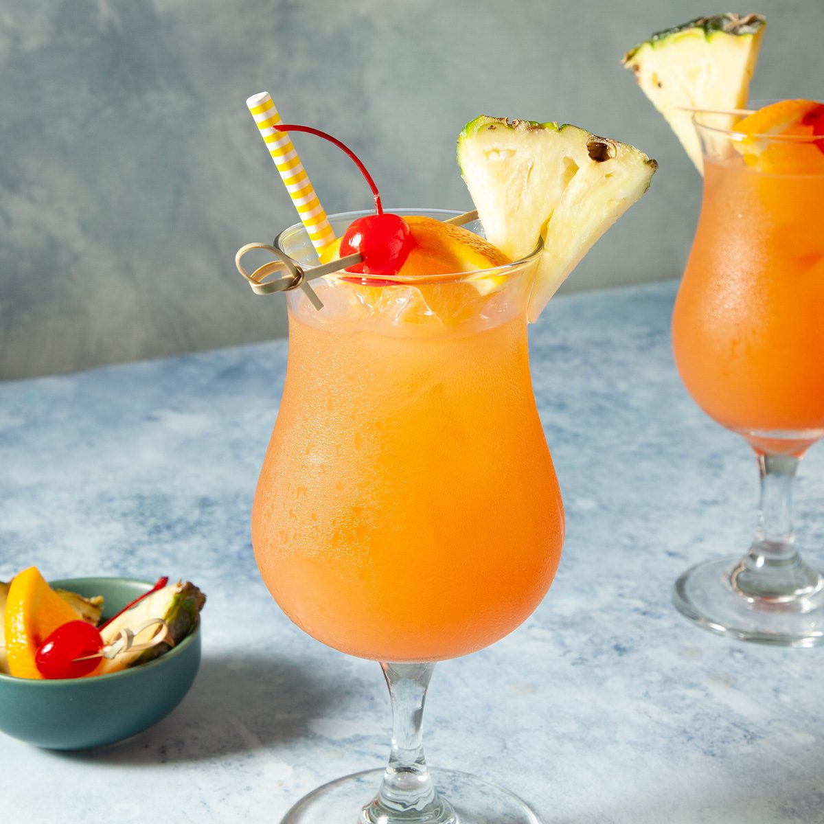 wide shot of sweet rum punch with fruits