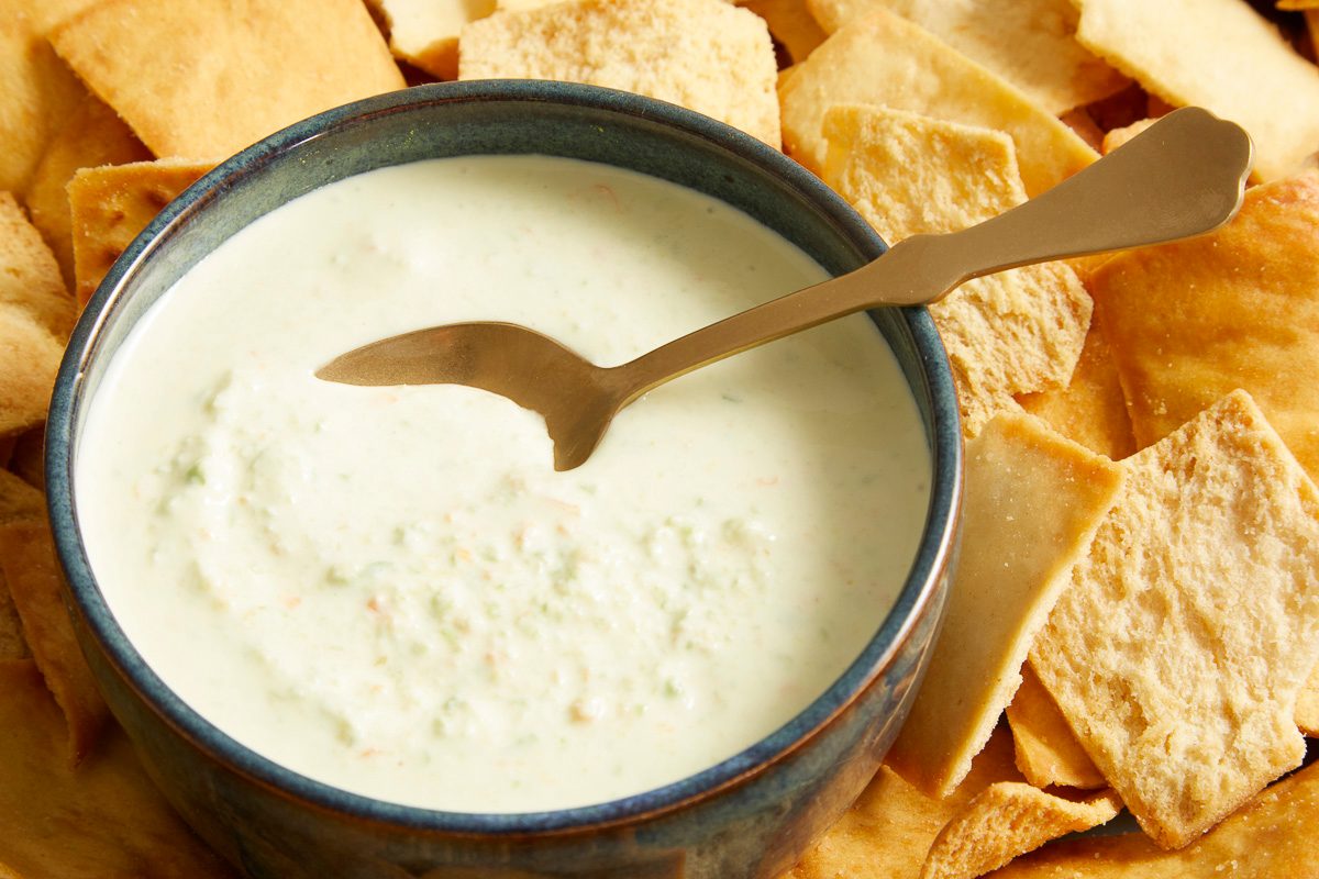 top angle close up of copycat Pineapple Habanero Dip surrounded by pita chips