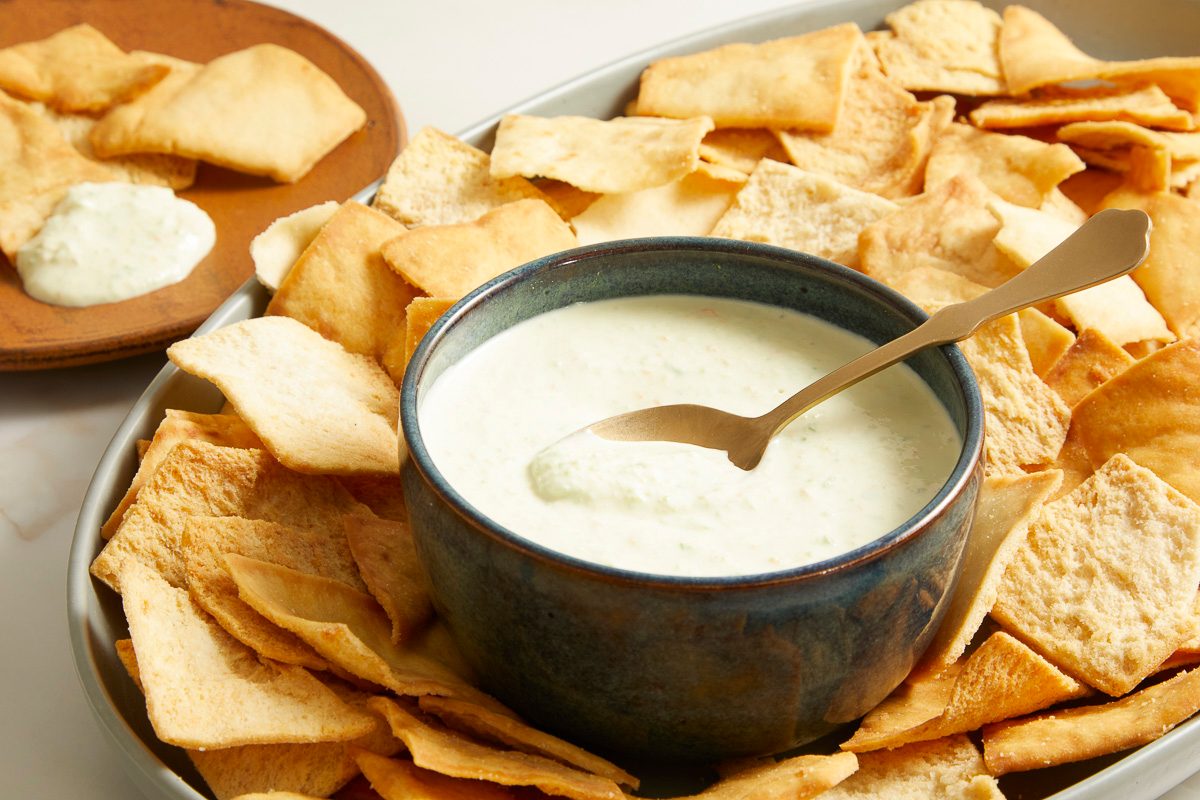 Copycat Pineapple Habanero Dip surrounded by pita chips