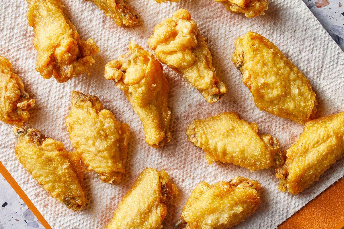 cooked chicken wings on a paper towel