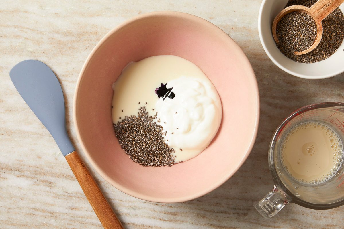 coconut yogurt, soy milk, chia seeds and purple sweet potato powder in a small bowl