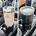 This Car Cup Holder Expander Makes Room for Even the Largest Water Bottles
