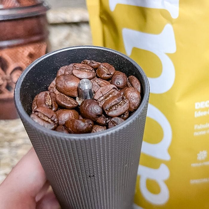Fabula Organic Medium Roast Decaf beans in a grinder