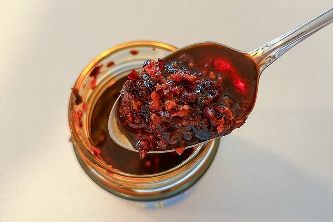 close up of Fly By Jing Mild Sichuan Chili Crisp in a spoon