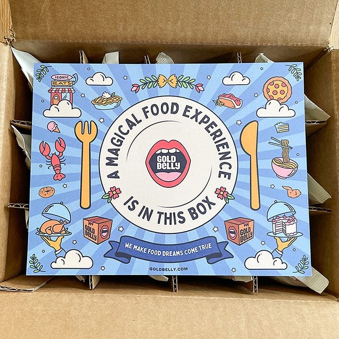 A colorful sign inside a box reads