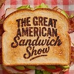 The Great American Sandwich Show logo on a sandwich on a wood counter