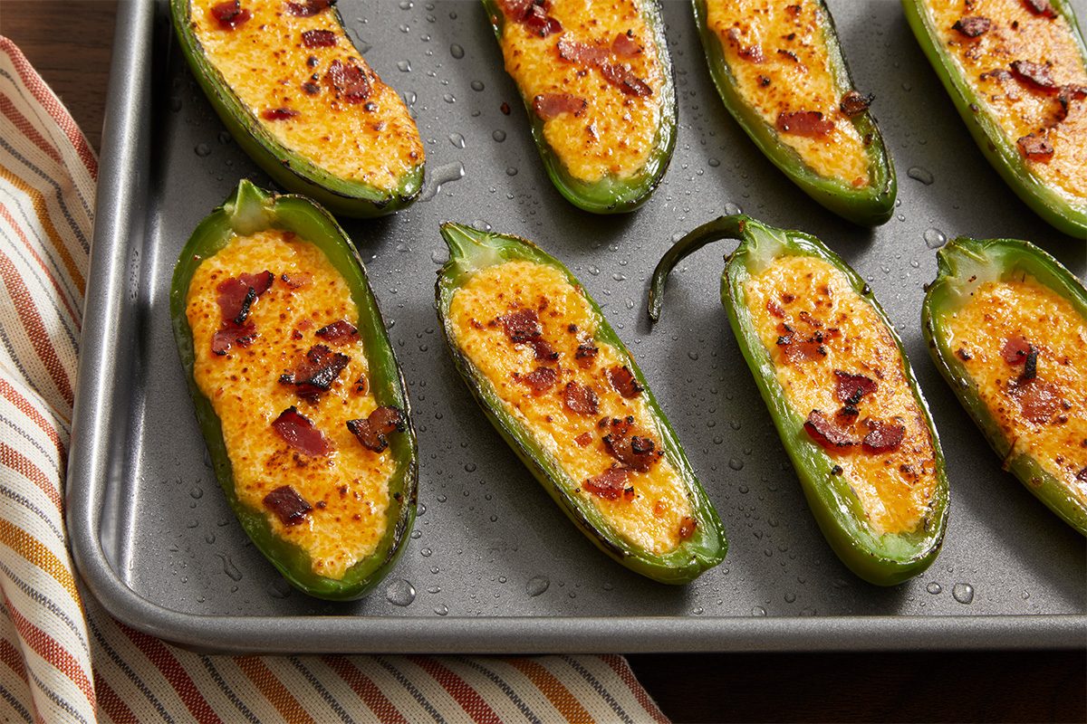 Close-up of a Easy Cheese-Stuffed Jalapeños, freshly baked until golden and slightly crispy on the edges.
