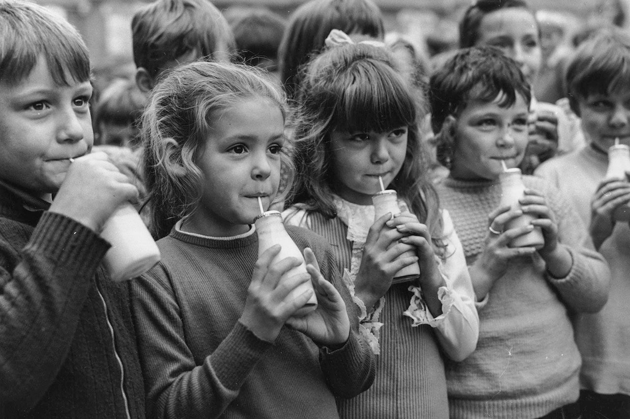 upils at Woodhill Primary School, Woolwich, south London, drink milk. 