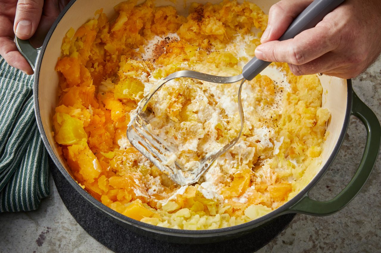 boiled vegetables, half-and-half, butter, sour cream, horseradish, pepper and nutmeg being mashed together