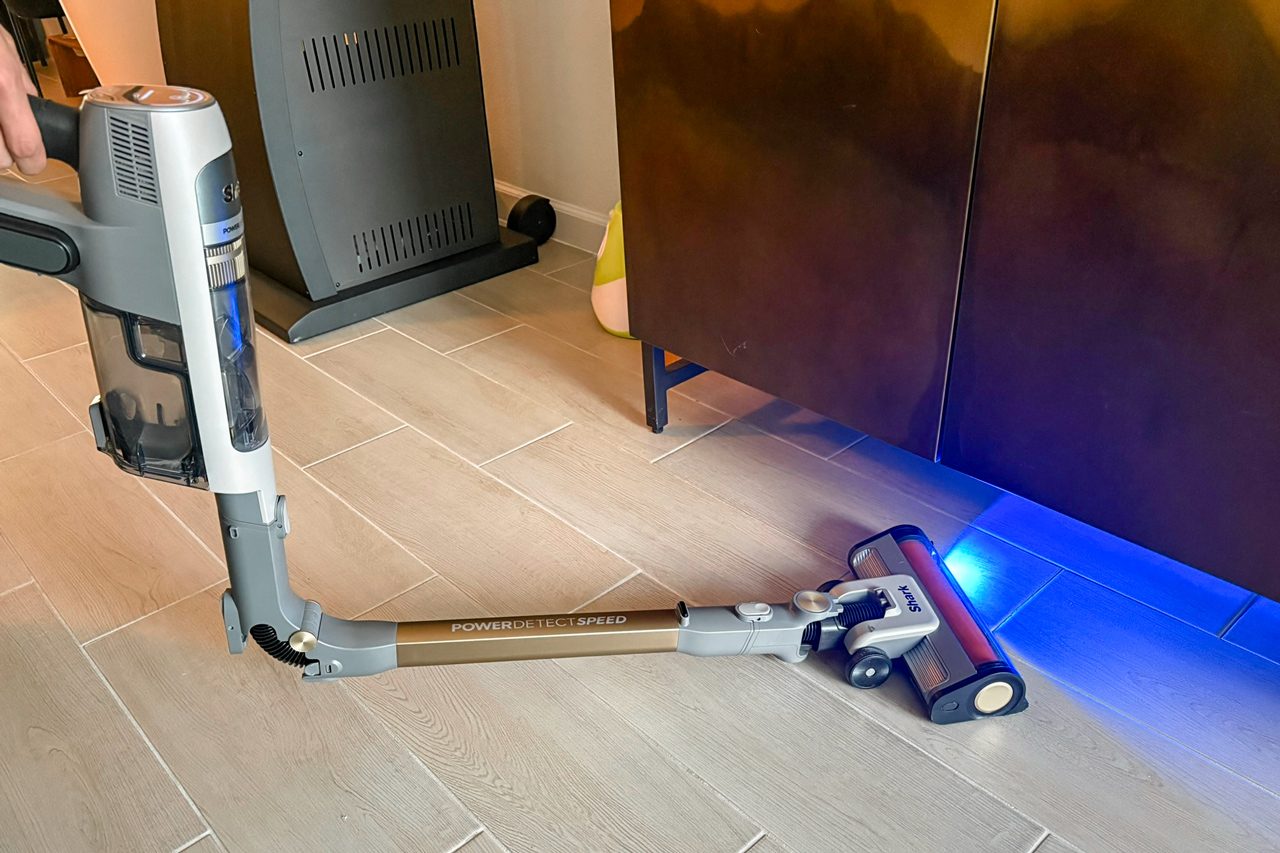 Shark Powerdetect Speed Clean & Empty vacuum cleaner bent in the middle with blue light on