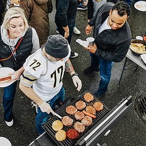 Group of friends tailgating in parking lot